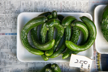 Japanese curved cucumbers at a Kyoto fruit market in Japan.