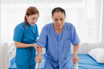 Physical therapy assistance Asian female doctor with senior man in physical therapy rehabilitation or health support Female physical therapist or physical therapist counseling an elderly patient.