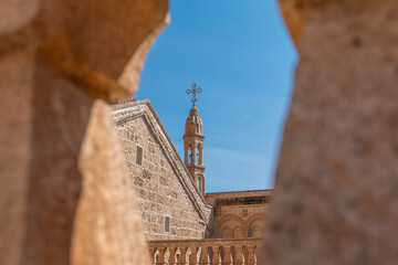 Mardin Midyat district Mor Gabriel Monastery unique architectural detail photographs taken with blue sky © Aytug Bayer