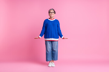 Photo of positive aged woman look up empty space isolated over pastel color background