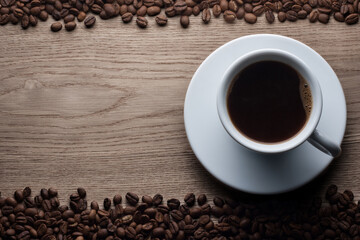 Cup of black coffee on wood table