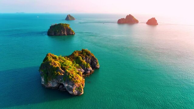 Aerial view of a small secluded tropical island in Thailand. Flight over small islands. 