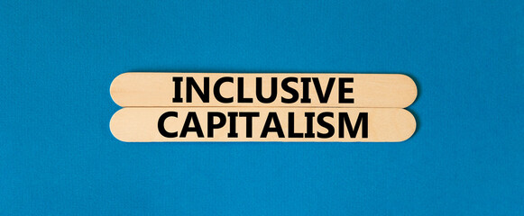 Inclusive capitalism symbol. Concept words Inclusive capitalism on beautiful wooden stick....