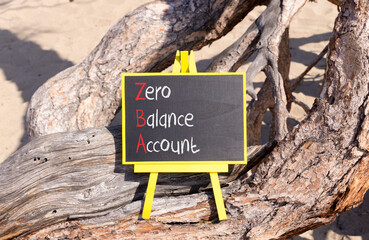 ZBA zero balance account symbol. Concept words ZBA zero balance account on beautiful yellow blackboard. Beautiful old tree background. Business ZBA zero balance account concept. Copy space.