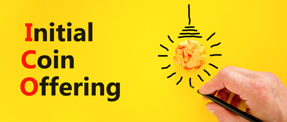 ICO initial coin offering symbol. Concept words ICO initial coin offering on beautiful paper....