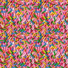 rainbow sprinkles on a pink icing background, repeatable seamless background tile
