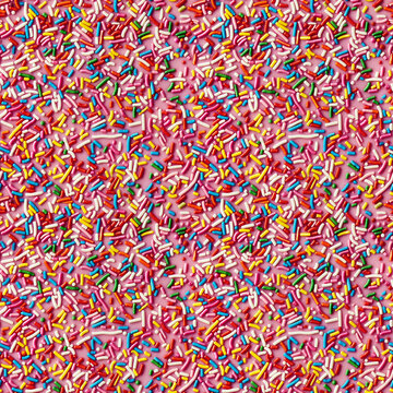 rainbow sprinkles on a pink icing background, repeatable seamless background tile