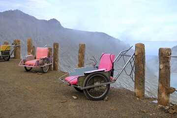 taxi carts that are used by locals to bring tourists to the top of beautiful ijen volcano, Java,...