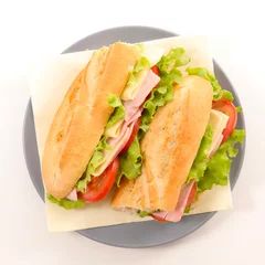  baguette sandwich with cheese, ham, tomato and lettuce © M.studio