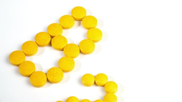 Vitamin B Pills isolated - B2 on white background