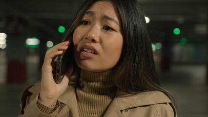 Irritated annoyed Asian chinese japanese woman stressed korean girl talk mobile phone conversation...