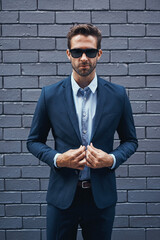 Businessman, bricks and trendy with suit and confident for fashion, clothing or clothes and cool....