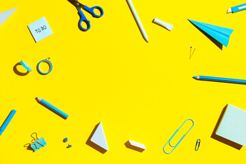 School supplies on yellow background. Back to school concept.	