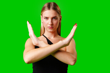 Young Woman Making Stop Sign Gesture on green background - 788421798