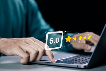 Businessman using laptop give rating to service experience on online application, 5-star...