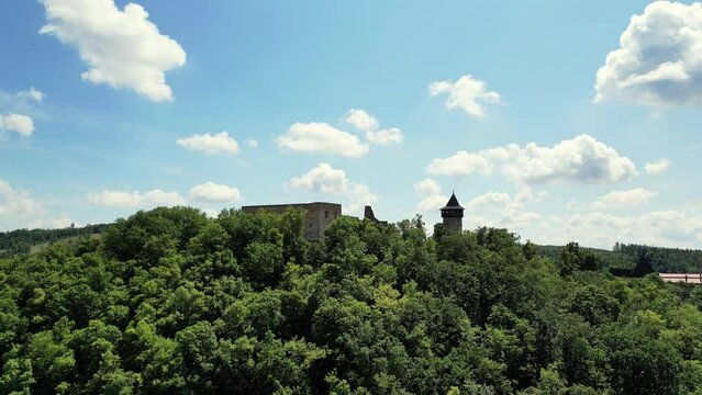 Aerial drone view of the landmark of Helfstyn Castle. Helftyn Castle overlooking the hills where the castle lies during a beautiful sunny day. Located in Czech republic