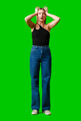 Young Woman Holding Hands Up to Head against green background