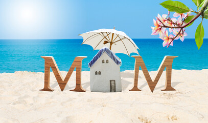 Mother's day card background idea, mom wooden font on tropical beach, summer outdoor day light