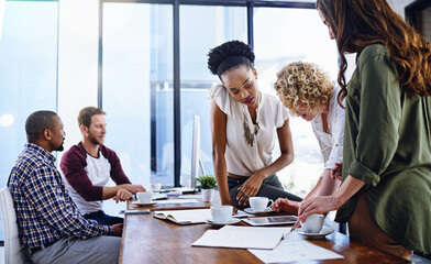 Diversity, colleagues and conversation in office with tablet, research or browse for business...