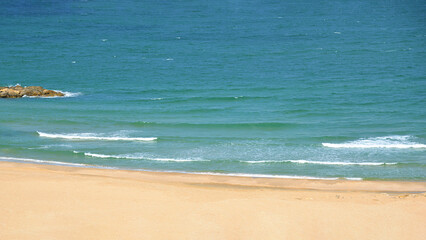 soft wave of the sea on the sandy beach. holidays and relaxation by the sea