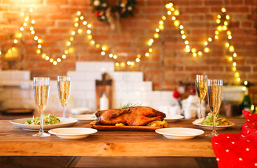 Christmas dinner with roast duck and champagne