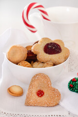 Christmas cookies decorated with jam on the white background