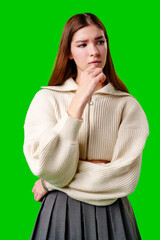 Young Woman Contemplating Deeply Against a Vibrant Green Background - 788448955
