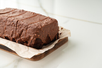 Fresh homemade chocolate sponge cake on wooden board - 788449922
