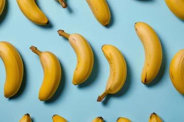  Pattern of bananas on blue background with one on top and one on bottom © SHOTPRIME STUDIO