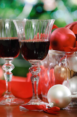 Glasses of red wine and Christmas decorations