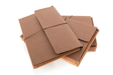 a stack of brown accordion file folders without labels isolated on white