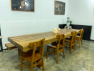 empty wooden dining table blured background