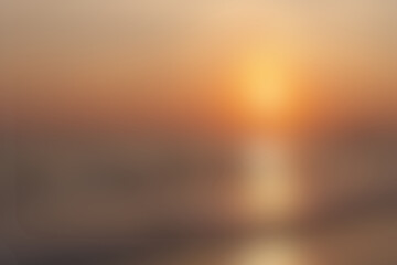 Beautiful blurry sunset seascape. on horizon, sun circle isolated on orange sky background, sunny...