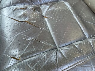 Worn and Torn Leather Car Seat
