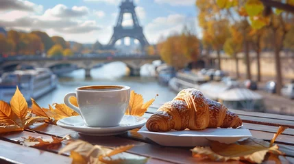 Fotobehang croissant and coffee on the table with a view to the eiffel tower © IgnacioJulian
