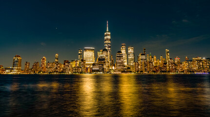 Skyscraper building of NYC panorama. NY urban city architecture. Night Manhattan at Hudson river....