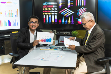 Businessmen showing business growth on diagram graph and presenting on screen in business seminar