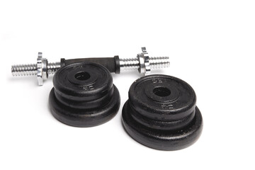 two 15 pound 10 kilo black weight lifting barbells isolated on white