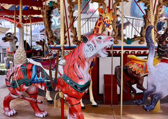 Fototapeta na wymiar jungle animal themed carousel in the park