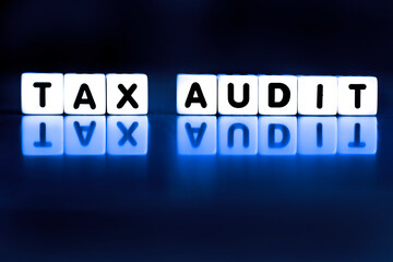 Tax Audit Spelled Out in Block Words Representing IRS Audit Stressful Taxes