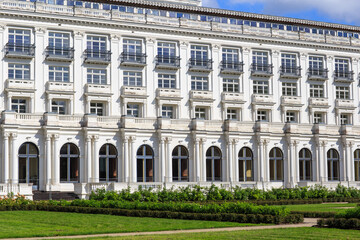 white hotel building in a summer park