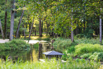 wooden house for ducks in the park 