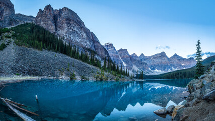 Alpine lake in mountains at blue hour. Moraine Lake in Banff National Park, Canadian Rockies, Alberta, Canada.