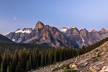 Epic panorama view at blue hour of scenic alpine landscape of The Valley of the 10 Peaks in the Rocky Mountains of Banff National Park, Alberta, Canada.
