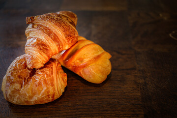 variety of french viennoiseries on wooden surface
