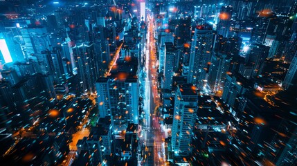 A nighttime aerial view of a cityscape featuring a sprawling maze of twinkling lights from moving cars traveling down the empty streets - obrazy, fototapety, plakaty