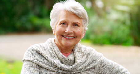 Park, happy and portrait of elderly woman in nature for sunshine, environment and retirement....