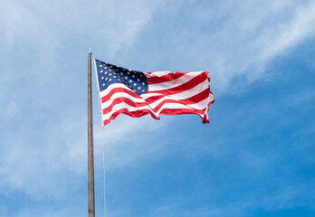 Flag of the USA. National waving flag of united states on blue sky. Independence day. Patriotic symbol. American Flag for Memorial Day or 4th of July. American flag waving in the wind. July 4th - 788510500