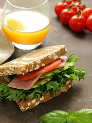 rye bread sandwich with vegetables and ham