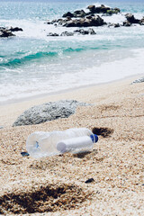 Plastic bottle on seashore.